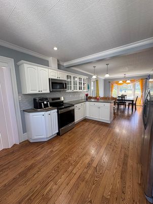 Dining room, Interior, Kitchen, Pendant Lights, Recessed Lighting, Stainless Steel Appliances, Wood Texture Flooring