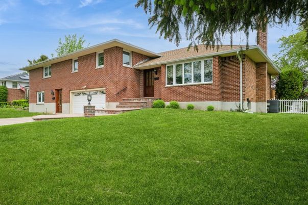Attached, Backyard, Exterior, Facade, Brick Facade, Split Level