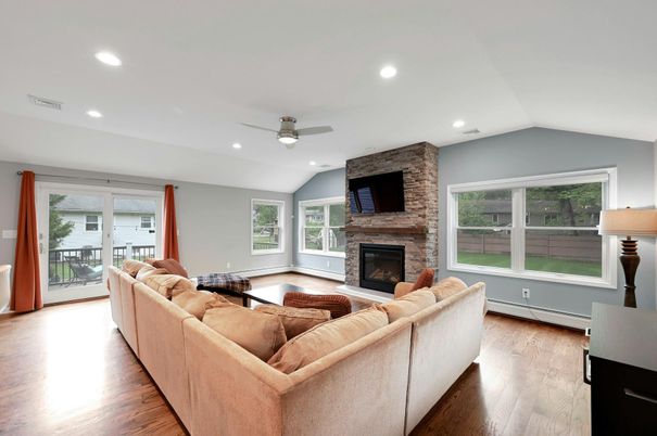 Fireplace, Interior, Living room, Recessed Lighting, Stone Walls, Wood Texture Flooring