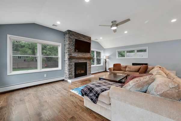 Fireplace, Interior, Living room, Recessed Lighting, Stone Walls, Wood Texture Flooring