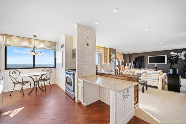 Dining room, Interior, Kitchen, Living room, Pendant Lights, Recessed Lighting, Stainless Steel Appliances, Water, Wood Texture Flooring