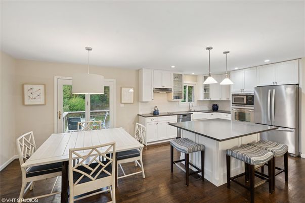 Dining room, Interior, Kitchen, Pendant Lights, Recessed Lighting, Stainless Steel Appliances, Wood Texture Flooring