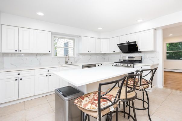 Interior, Kitchen, Marble Walls, Recessed Lighting, Stainless Steel Appliances, Wood Texture Flooring