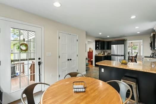 Dining room, Interior, Kitchen, Recessed Lighting, Stainless Steel Appliances, Wood Texture Flooring