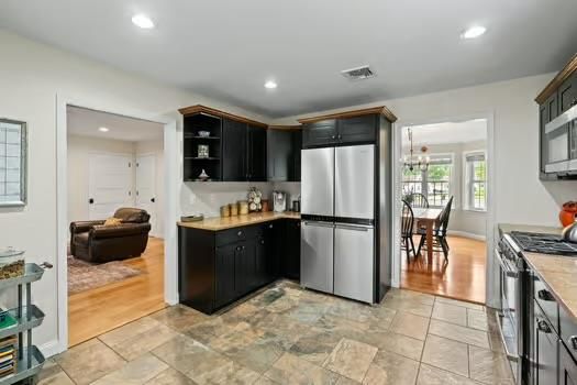 Chandelier, Dining room, Interior, Kitchen, Living room, Recessed Lighting, Stainless Steel Appliances, Wood Texture Flooring