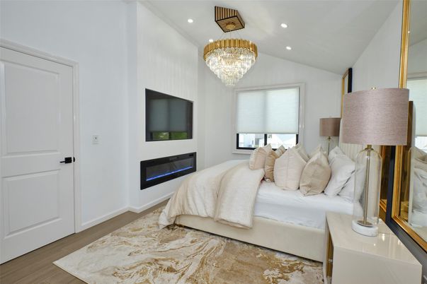 Bedroom, Chandelier, Fireplace, Interior, Recessed Lighting, Wood Texture Flooring