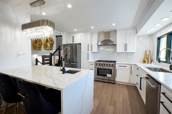 Chandelier, Interior, Kitchen, Marble Walls, Pendant Lights, Recessed Lighting, Stainless Steel Appliances, Wood Texture Flooring