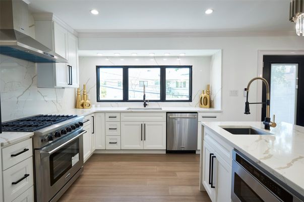 Interior, Kitchen, Marble Walls, Recessed Lighting, Stainless Steel Appliances, Wood Texture Flooring
