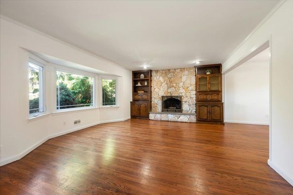 Empty room, Fireplace, Interior, Recessed Lighting, Stone Walls, Wood Texture Flooring