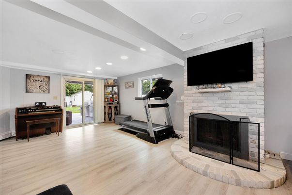Fireplace, Fitness Equipment, Interior, Piano, Recessed Lighting, Stone Walls, Wood Texture Flooring