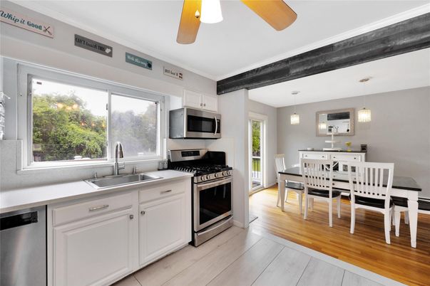 Dining room, Interior, Kitchen, Pendant Lights, Stainless Steel Appliances, Wood Texture Flooring