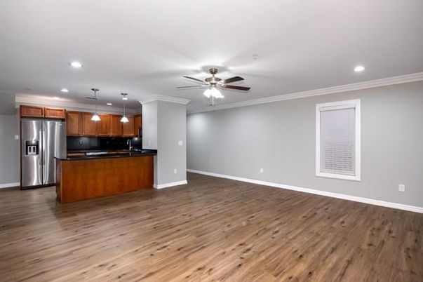 Empty room, Interior, Kitchen, Pendant Lights, Recessed Lighting, Stainless Steel Appliances, Wood Texture Flooring