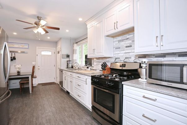 Dining room, Interior, Kitchen, Recessed Lighting, Stainless Steel Appliances, Wood Texture Flooring