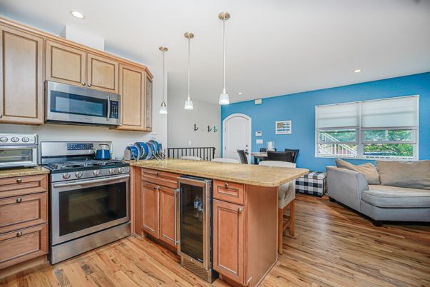 Dining room, Interior, Kitchen, Living room, Pendant Lights, Recessed Lighting, Stainless Steel Appliances, Wood Texture Flooring