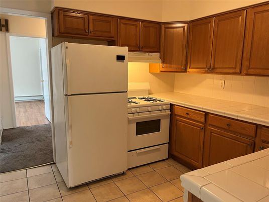 Interior, Kitchen, Tile Countertops, Wood Texture Flooring