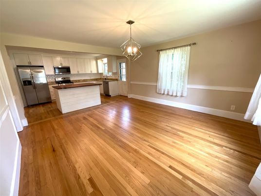 Empty room, Interior, Kitchen, Pendant Lights, Stainless Steel Appliances, Wood Texture Flooring