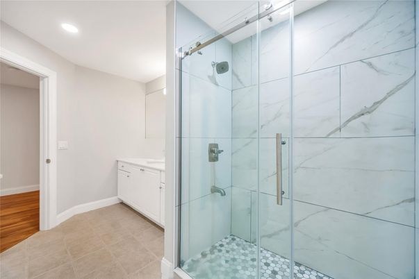 Bathroom, Glass Shower, Interior, Marble Walls, Recessed Lighting, Wood Texture Flooring