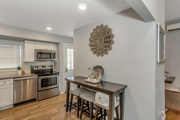 Dining room, Interior, Kitchen, Recessed Lighting, Stainless Steel Appliances, Wood Texture Flooring