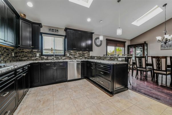 Dining room, Interior, Kitchen, Pendant Lights, Recessed Lighting, Stainless Steel Appliances, Wood Texture Flooring