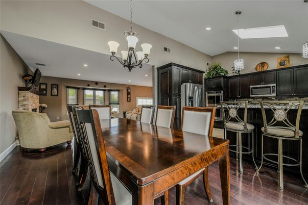 Chandelier, Dining room, Interior, Kitchen, Recessed Lighting, Stainless Steel Appliances, Wood Texture Flooring