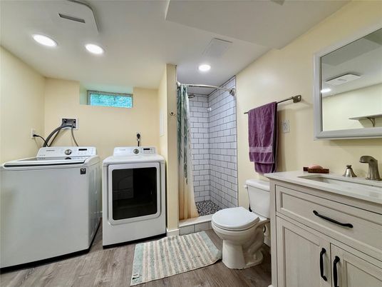 Bathroom, Interior, Recessed Lighting, Washer, Wood Texture Flooring