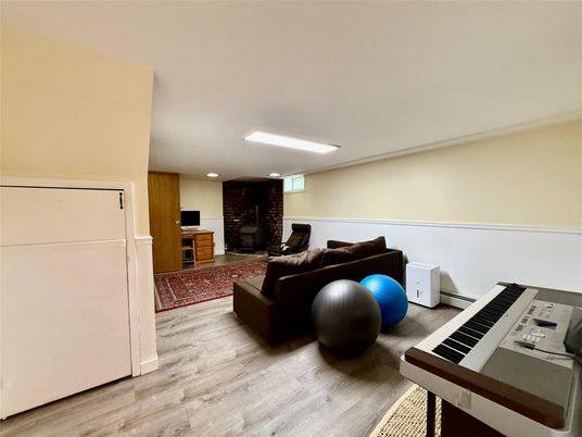 Fireplace, Interior, Living room, Piano, Recessed Lighting, Wood Texture Flooring