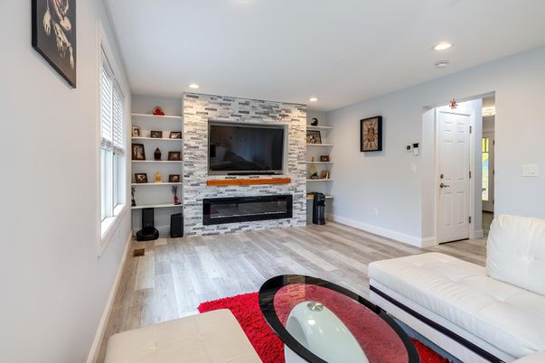 Fireplace, Interior, Living room, Recessed Lighting, Stone Walls, Wood Texture Flooring