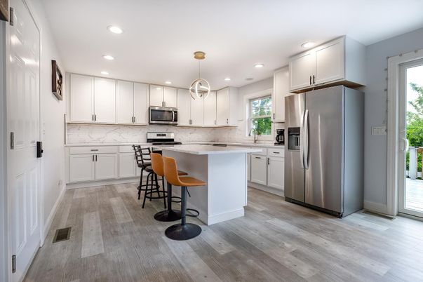 Interior, Kitchen, Marble Walls, Pendant Lights, Recessed Lighting, Stainless Steel Appliances, Wood Texture Flooring