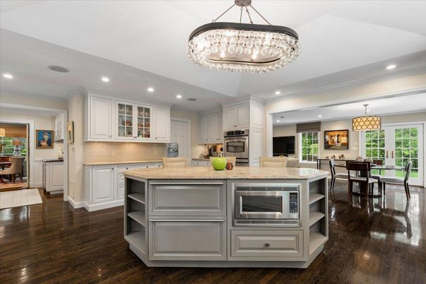 Chandelier, Dining room, Interior, Kitchen, Pendant Lights, Recessed Lighting, Stainless Steel Appliances, Wood Texture Flooring