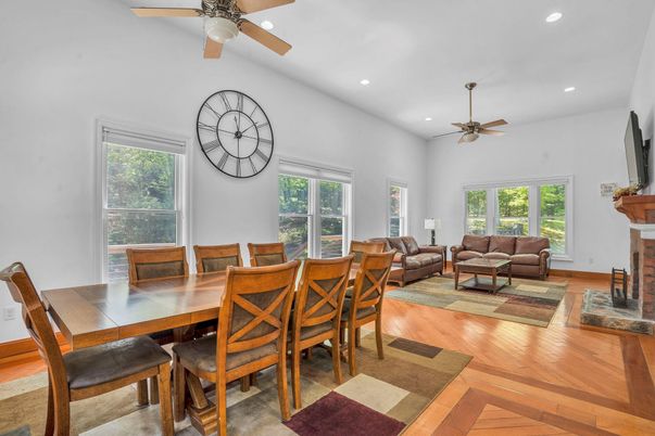Dining room, Fireplace, Interior, Living room, Recessed Lighting, Wood Texture Flooring
