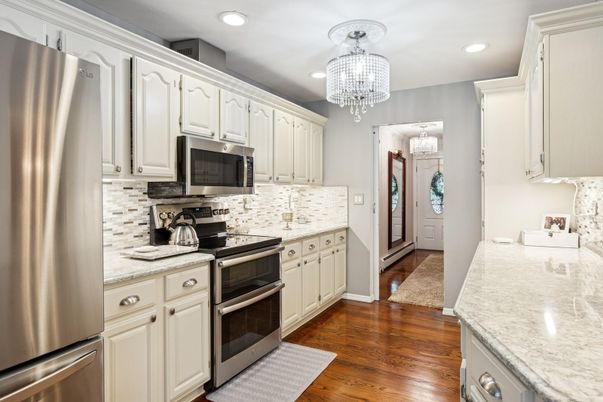 Chandelier, Interior, Kitchen, Recessed Lighting, Stainless Steel Appliances, Wood Texture Flooring