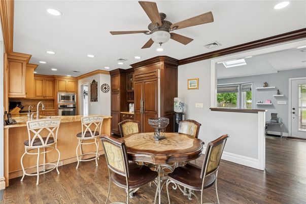 Dining room, Interior, Kitchen, Recessed Lighting, Stainless Steel Appliances, Wood Texture Flooring