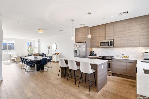 Dining room, Interior, Kitchen, Pendant Lights, Recessed Lighting, Stainless Steel Appliances, Wood Texture Flooring