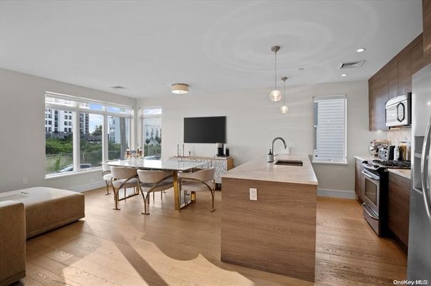Dining room, Interior, Kitchen, Pendant Lights, Recessed Lighting, Stainless Steel Appliances, Wood Texture Flooring
