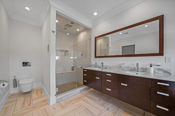 Bathroom, Dual Sink Vanities, Glass Shower, Interior, Recessed Lighting, Wood Texture Flooring
