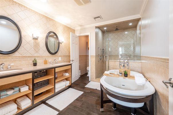 Bathroom, Dual Sink Vanities, Glass Shower, Interior, Recessed Lighting, Wood Texture Flooring