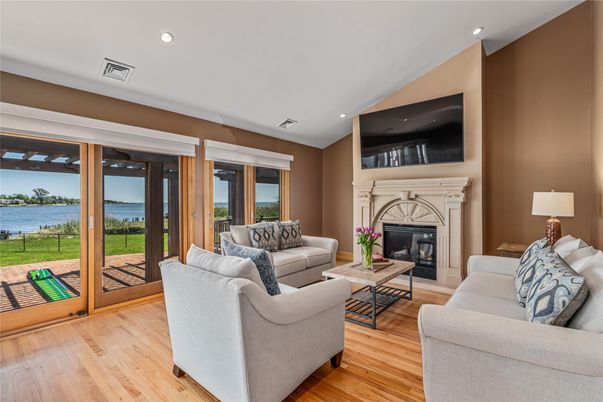 Fireplace, Interior, Living room, Recessed Lighting, Water, Wood Texture Flooring