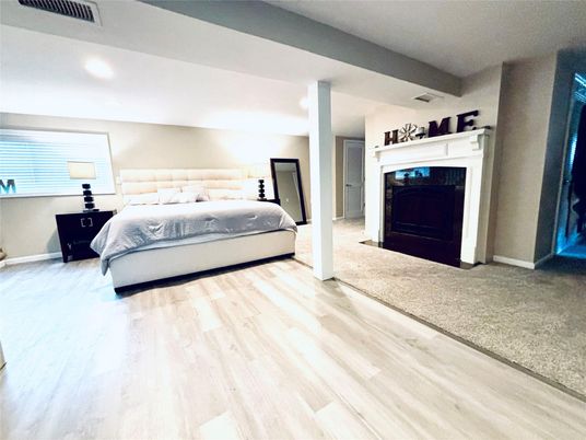 Bedroom, Fireplace, Interior, Recessed Lighting, Wood Texture Flooring