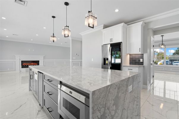 Fireplace, Interior, Kitchen, Marble, Pendant Lights, Recessed Lighting, Stainless Steel Appliances