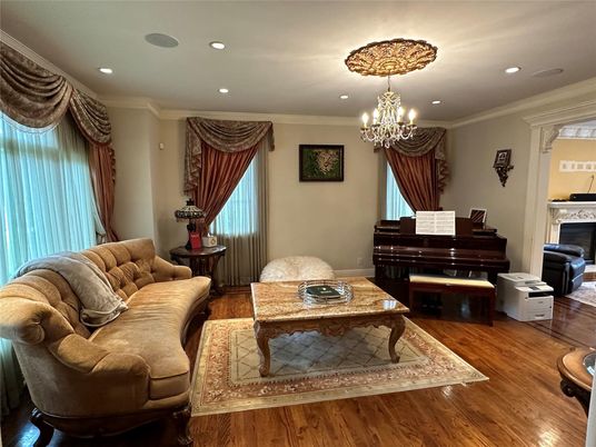 Chandelier, Fireplace, Interior, Living room, Piano, Recessed Lighting, Wood Texture Flooring
