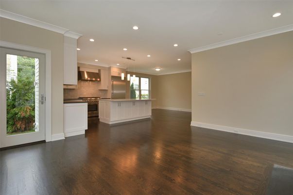 Empty room, Interior, Kitchen, Pendant Lights, Recessed Lighting, Stainless Steel Appliances, Wood Texture Flooring