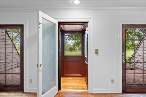 Elevator, Interior, Recessed Lighting, Wood Texture Flooring, Wooden Walls