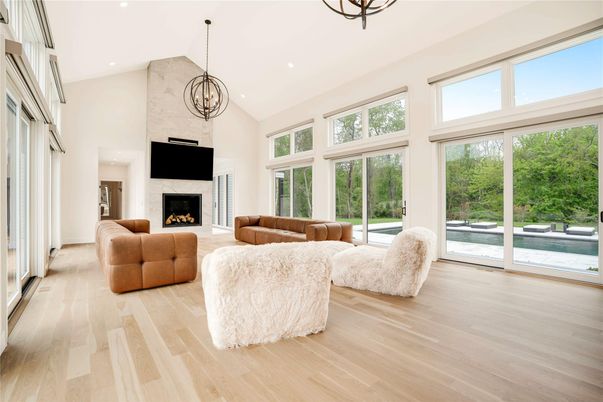 Chandelier, Fireplace, Interior, Living room, Pendant Lights, Recessed Lighting, Wood Texture Flooring