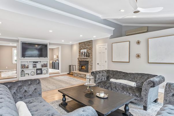 Fireplace, Interior, Living room, Recessed Lighting, Stone Walls, Wood Texture Flooring