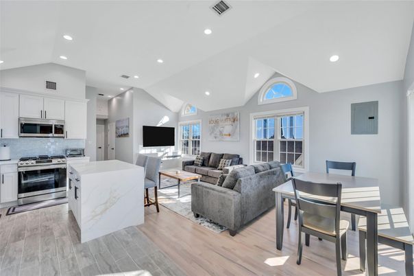 Dining room, Interior, Kitchen, Living room, Recessed Lighting, Stainless Steel Appliances, Wood Texture Flooring