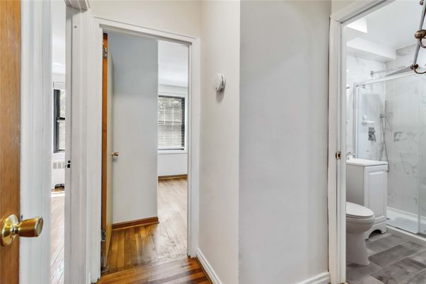 Bathroom, Glass Shower, Interior, Marble Walls, Wood Texture Flooring