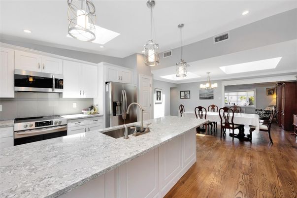 Chandelier, Dining room, Interior, Kitchen, Pendant Lights, Recessed Lighting, Stainless Steel Appliances, Wood Texture Flooring