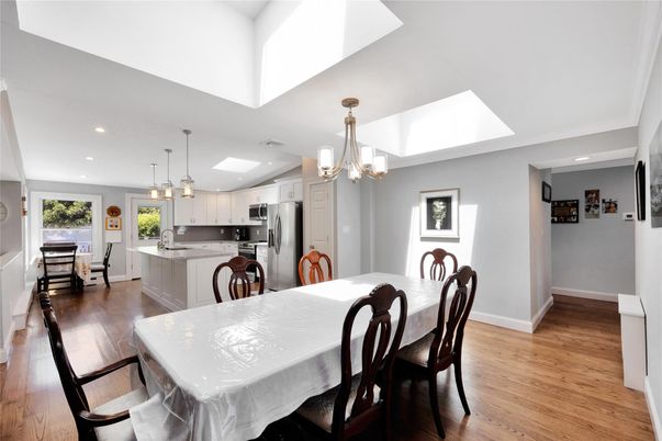 Chandelier, Dining room, Interior, Kitchen, Pendant Lights, Recessed Lighting, Stainless Steel Appliances, Wood Texture Flooring