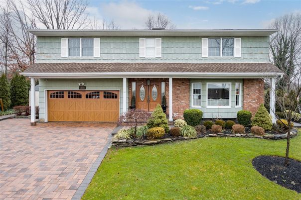 Attached, Exterior, Facade, Brick Facade, American Foursquare