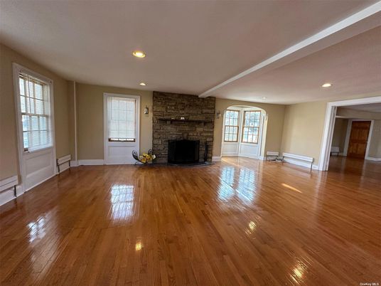 Empty room, Fireplace, Interior, Recessed Lighting, Stone Walls, Wood Texture Flooring